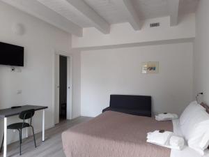 Postel nebo postele na pokoji v ubytování Country House-B&B-Appartamenti Ai Cipressi