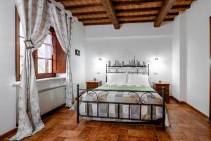 Postel nebo postele na pokoji v ubytování Agriturismo Meriggio