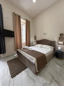 Giường trong phòng chung tại Valentino suites&terrace