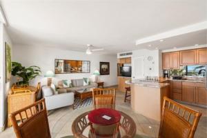 a kitchen and living room with a couch and a table at Kihei Beach, #603^ condo in Kihei