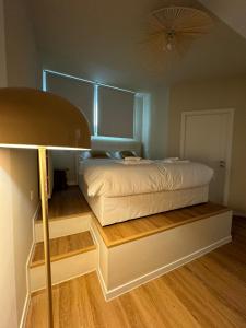 Postel nebo postele na pokoji v ubytování D-HOME Suites