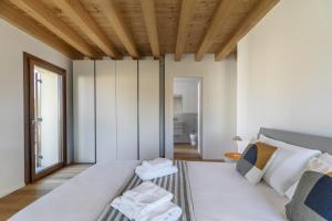 Molino4 by WelcHome客房内的一张或多张床位