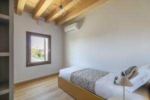 Molino4 by WelcHome客房内的一张或多张床位