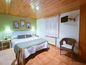 A bed or beds in a room at Casa Rural Macia - Apartamentos