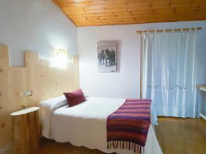 A bed or beds in a room at Casa Rural Macia - Apartamentos