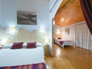 A bed or beds in a room at Casa Rural Macia - Apartamentos