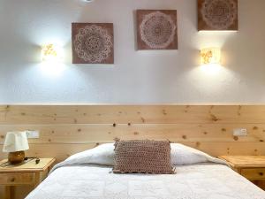 A bed or beds in a room at Casa Rural Macia - Apartamentos