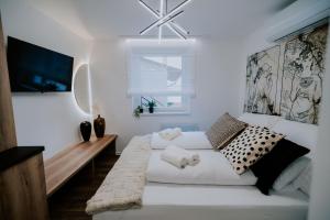 Posteľ alebo postele v izbe v ubytovaní Maison de Luxe