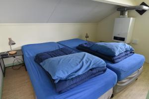 Postel nebo postele na pokoji v ubytování Vakantiehuis Weids uitzicht nabij Tjeukemeer