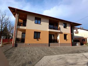 a building with a lot of windows on it at ORCHIDEA PREMIUM Apartment in Hévíz