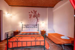 Postel nebo postele na pokoji v ubytování Agriturismo Meriggio
