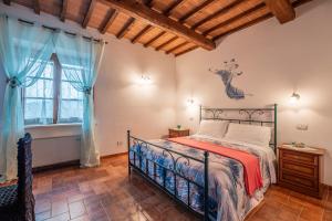 Postel nebo postele na pokoji v ubytování Agriturismo Meriggio