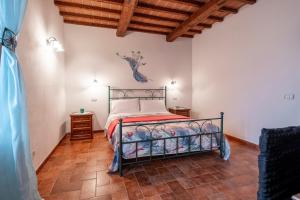 Postel nebo postele na pokoji v ubytování Agriturismo Meriggio