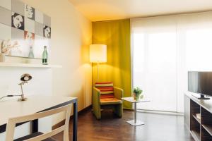 Sjónvarps- og/eða afþreyingartæki á harry's home Hart bei Graz hotel & apartments