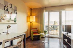 Sjónvarps- og/eða afþreyingartæki á harry's home Hart bei Graz hotel & apartments
