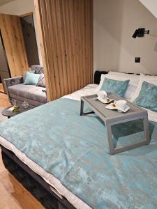 A bed or beds in a room at Nest 316 Bela Reka Kopaonik