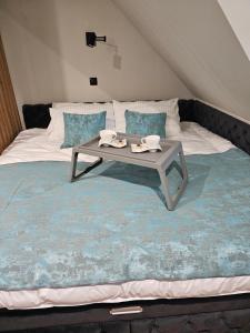 A bed or beds in a room at Nest 316 Bela Reka Kopaonik