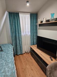 A bed or beds in a room at Nest 316 Bela Reka Kopaonik