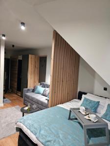 A bed or beds in a room at Nest 316 Bela Reka Kopaonik