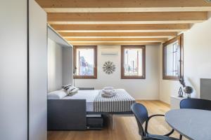 Voodi või voodid majutusasutuse Molino 2 by WelcHome toas