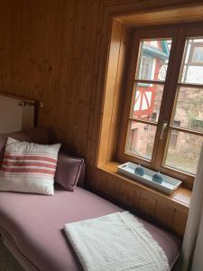Postel nebo postele na pokoji v ubytování Ferienwohnung in historischer Mühle