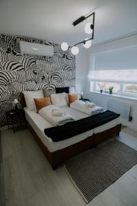 Posteľ alebo postele v izbe v ubytovaní Maison de Luxe