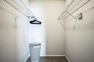 a hallway with a trash can in a room at 3001 Crystal Springs 721 I Spacious 2 Bed 2 Bath in Bedford