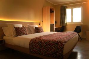 Letto o letti in una camera di Hotel-Restaurant Stand'Inn