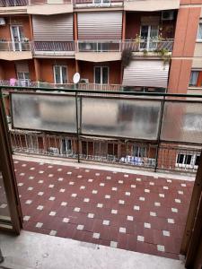 an outside view of a building with a checkered floor at Desiré Flat - Vatican City - Metro Cipro and WiFi in Rome