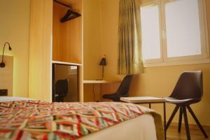 Letto o letti in una camera di Hotel-Restaurant Stand'Inn