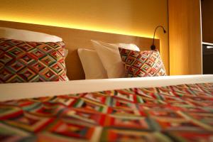 Letto o letti in una camera di Hotel-Restaurant Stand'Inn