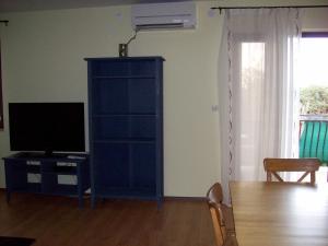 Televízia a/alebo spoločenská miestnosť v ubytovaní Apartment Monfiorenzo 11