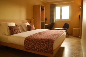 Letto o letti in una camera di Hotel-Restaurant Stand'Inn