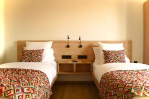 Letto o letti in una camera di Hotel-Restaurant Stand'Inn