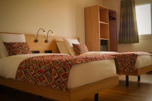 Letto o letti in una camera di Hotel-Restaurant Stand'Inn