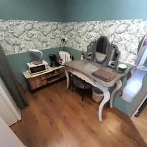 a dressing table with a mirror on a wall at L'olivier TESSA Hôtesse suite 30m2 terrasse 20m2 in La Celle +14 photos