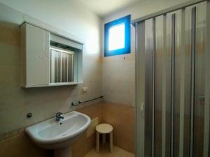 a bathroom with a sink and a shower at La Casa del Marinaio P1 in San Foca