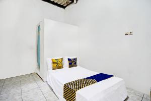 Кровать или кровати в номере Hotel O Tarlo Guest House 4 +20 фотографий