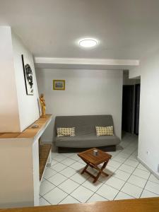 a living room with a couch and a table at Quadrale in Sotta