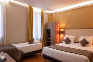 Postel nebo postele na pokoji v ubytování Hotel Cactus