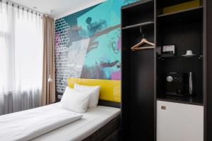 Ein Bett oder Betten in einem Zimmer der Unterkunft Hotel Berlin, Berlin, a member of Radisson Individuals