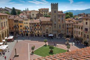 a city square in a town with buildings at Cognaia Country by Holiday World in Arezzo