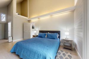 a bedroom with a blue bed and two night stands at Sapphire Serenity - 1 BR in Sapphire +13 photos