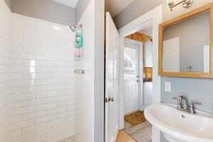 a bathroom with a sink and a mirror at Lobster Cove Retreat in Prospect Harbor +18 photos
