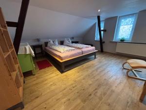 Postel nebo postele na pokoji v ubytování Ferienhaus Rennsteigidylle
