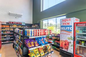 a store aisle with a lot of food and drinks at Malia Beach Experience - Muro Alto - Vista piscina central - Flat 205C in Ipojuca +37 photos
