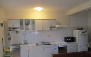 Kuchyň nebo kuchyňský kout v ubytování Apartments Bosiljka + 24 fotografií