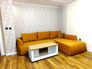 a living room with a couch and a table at Sofia hotel apartments in Sofia