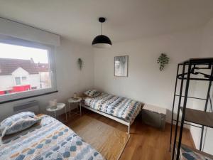 Postel nebo postele na pokoji v ubytování Stras' home