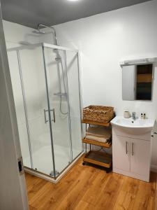 a bathroom with a shower and a sink at Bertra House B&B in Westport +91 photos